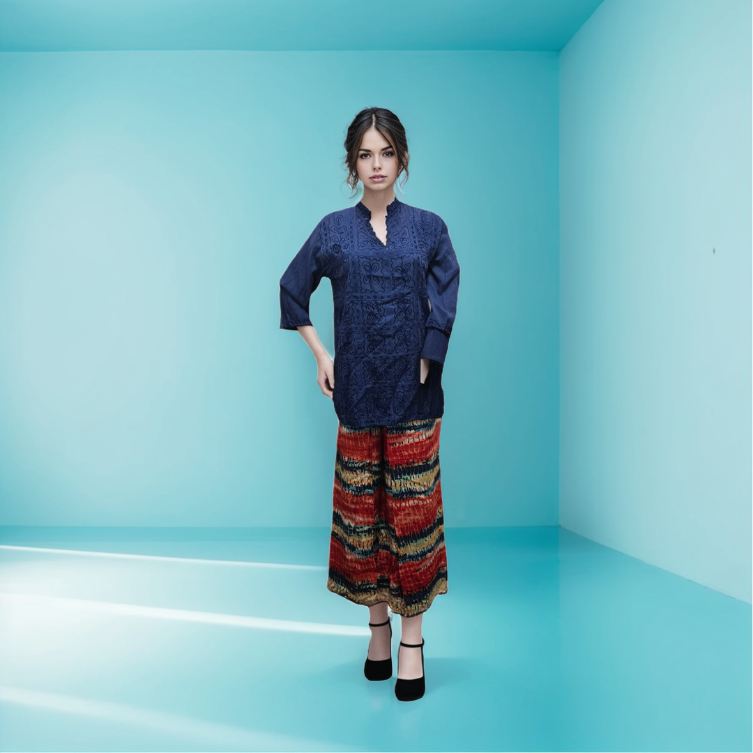 a woman standing in a room with a blue background